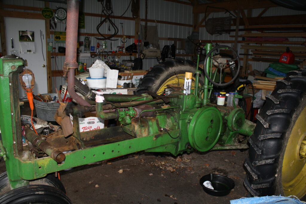 John Deere tractor torn down in garage