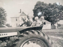 children in 1958 on John Deere tractor