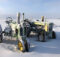 John Deere tractors in the snow